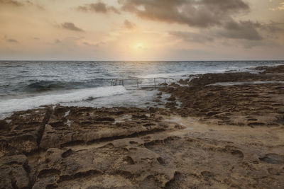 Scenic view of sea against sky during sunset