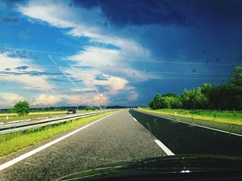 Road passing through field