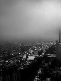 High angle view of buildings in city against sky