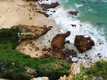 High angle view of rocks in sea