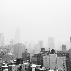 View of skyscrapers in fog