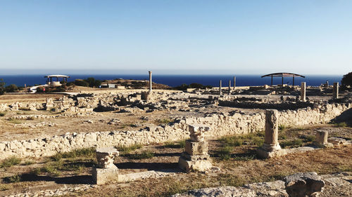 Built structure on landscape against clear sky