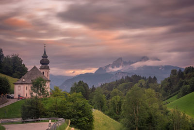 Panoramic view of trees and buildings against sky