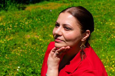 High angle view of woman with hand on chin