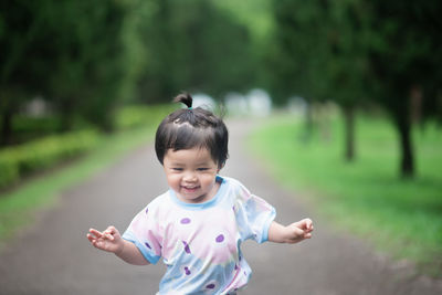 Portrait of cute girl standing outdoors