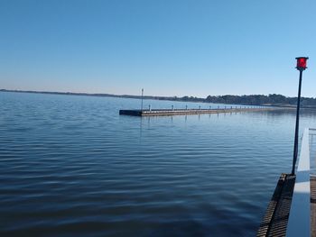 Scenic view of sea against clear blue sky