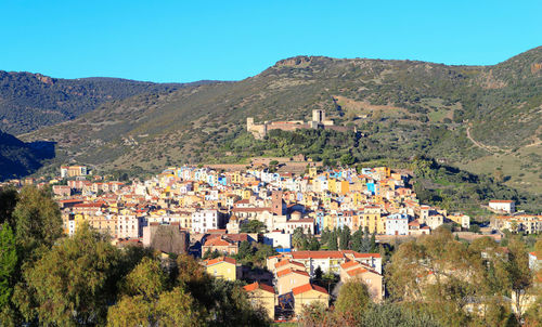 Panoramic shot of townscape against mountain