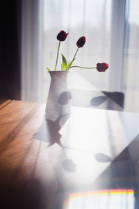 Flower vase on table