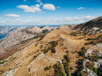 Scenic view of landscape and mountains against sky