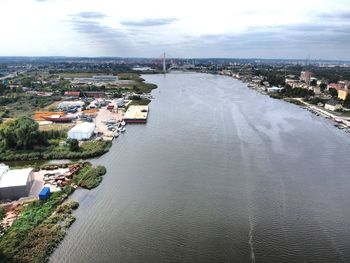 High angle view of river amidst buildings in city