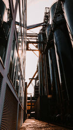 Low angle view of bridge against sky in city