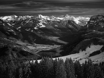 Scenic view of snowcapped mountains against sky