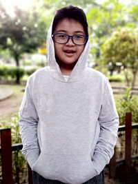 Portrait of young man standing outdoors