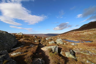 Panoramic view of rocks in mountains against sky