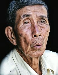 Close-up portrait of mid adult man