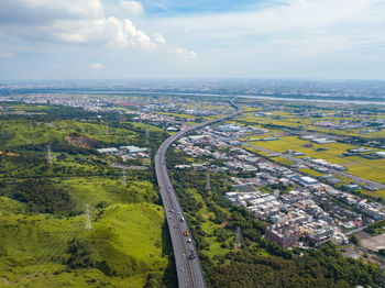 Aerial view of city against sky