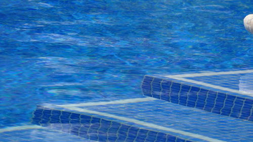 Swimming pool with sea in background