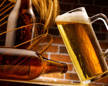 Close-up of beer glass on table
