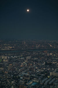 Aerial view of illuminated cityscape at night