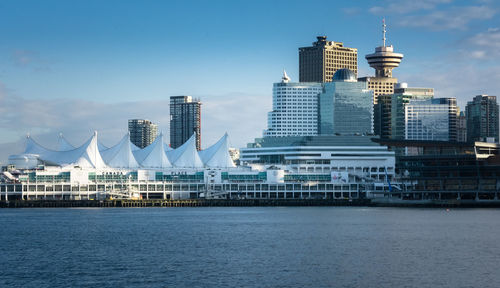 Modern buildings at waterfront in city