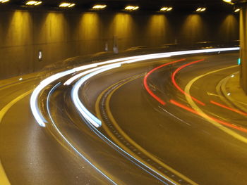 High angle view of light trails on road at night