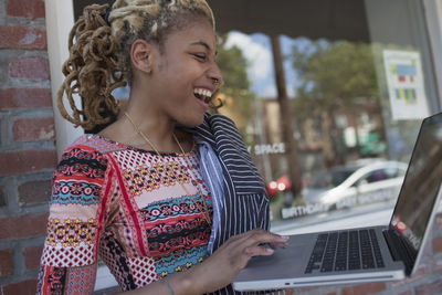 A young woman with a laptop