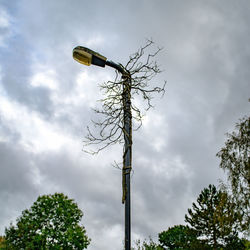Low angle view of street light against sky