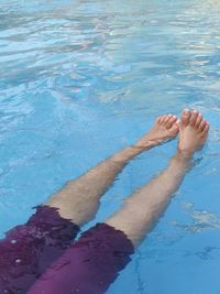 Low section of woman in swimming pool