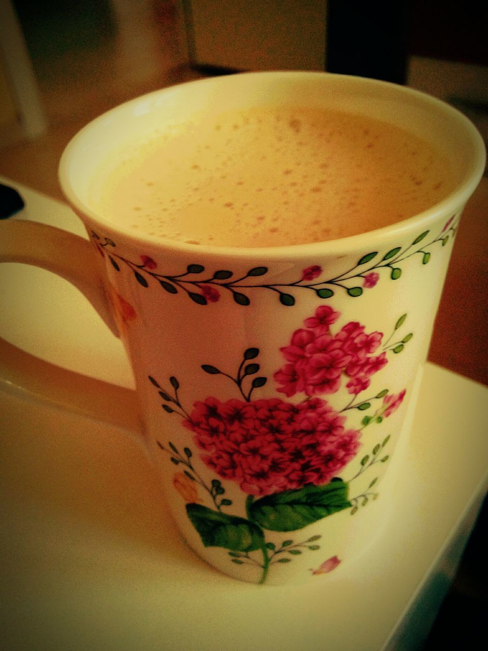 indoors, food and drink, drink, coffee cup, freshness, refreshment, table, still life, coffee - drink, close-up, saucer, coffee, frothy drink, cup, text, no people, cappuccino, western script, high angle view, spoon