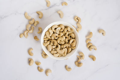 Directly above shot of roasted coffee beans on white background