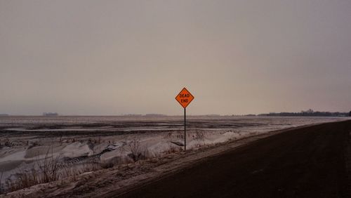 Dead end sign post on landscape