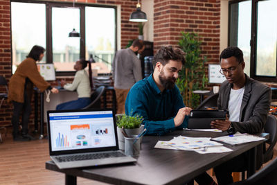 Business colleagues discussing at office