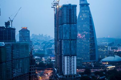 Modern buildings in city at dusk