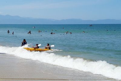 High angle view of people swimming in sea