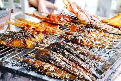 High angle view of meat on barbecue grill