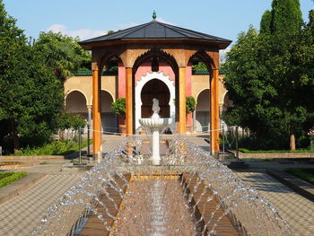 View of fountain in front of historical building