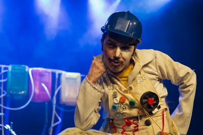 Actor representing a character on the stage of a theater. 