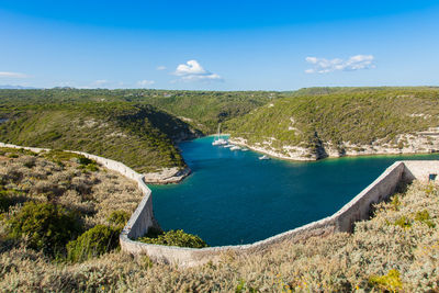 High angle view of landscape against blue sky