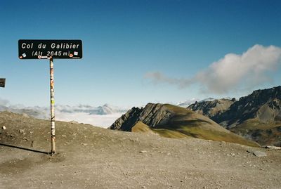 Information sign on landscape against clear sky