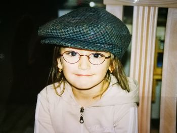 Close-up portrait of girl wearing flat cap