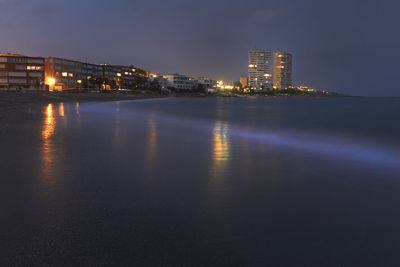 View of illuminated city at night