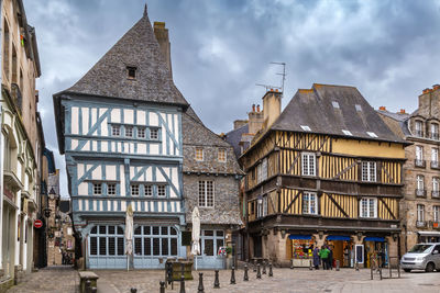 Street with half-timbered houses in dinan city center, brittany, france