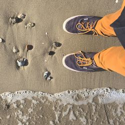 Low section of man on sand