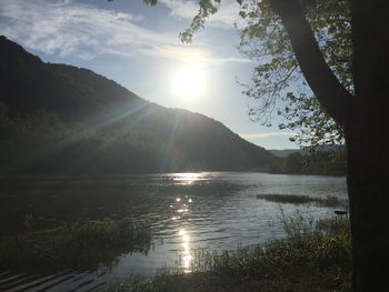 Scenic view of lake at sunset