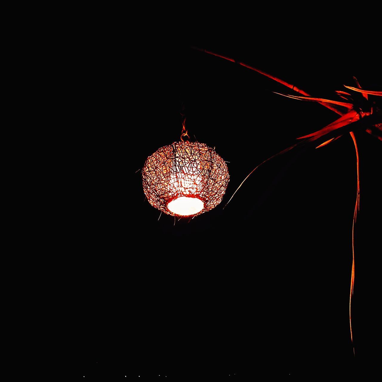 LOW ANGLE VIEW OF ILLUMINATED LIGHT BULB AGAINST SKY