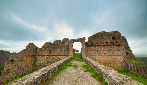 Old ruins against cloudy sky