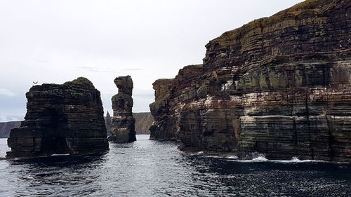 Panoramic view of rock formations against sky