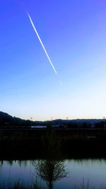 Scenic view of lake against blue sky