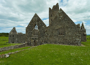Exterior photo of a well kept friary. 