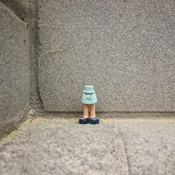 High angle view of woman standing on footpath